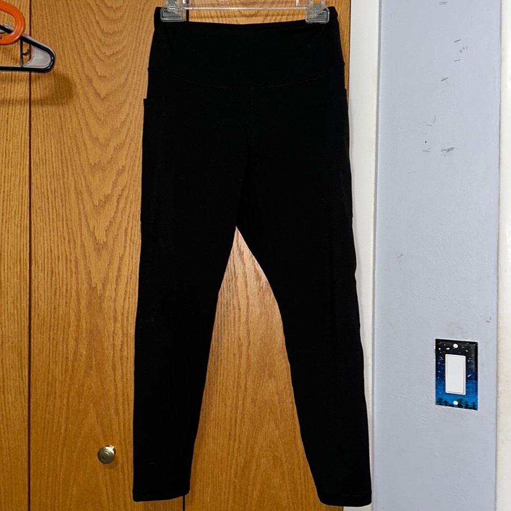 Black leggings, size L from Danskin. Polyester and spandex fabric.